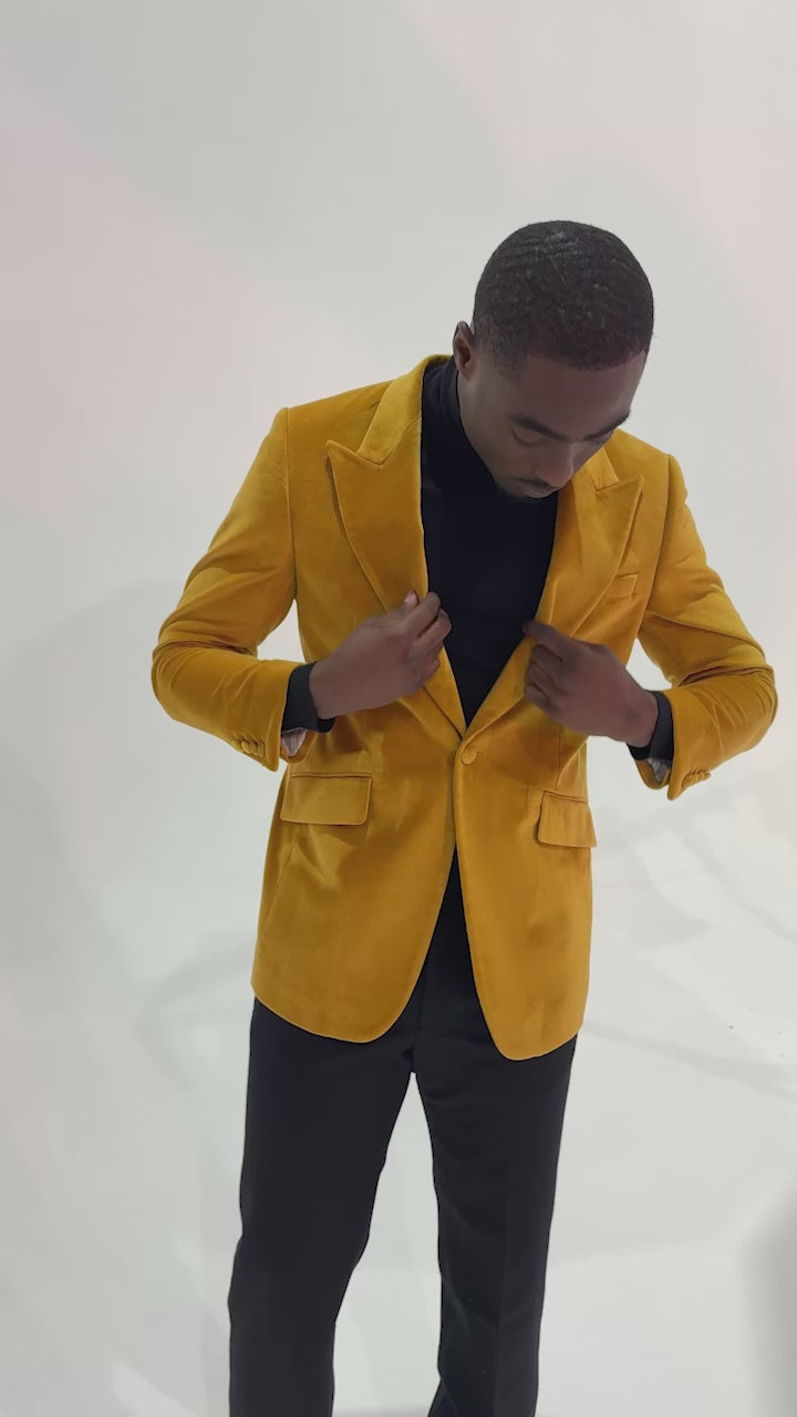 video of model wearing a gold velvet jacket